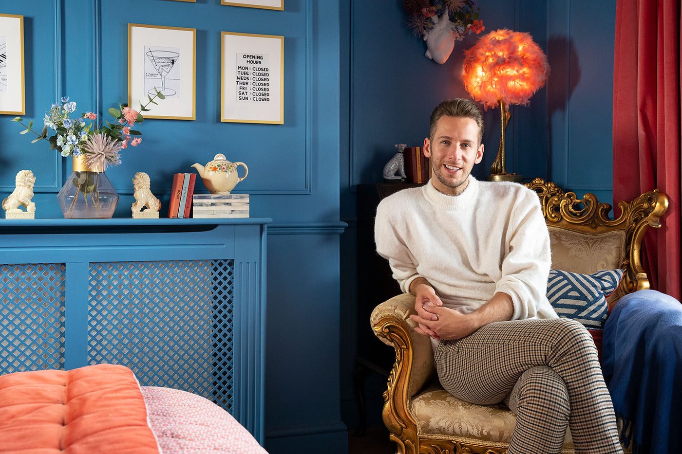 Jack D. March in his bedroom painted in Lick Blue 05 paint